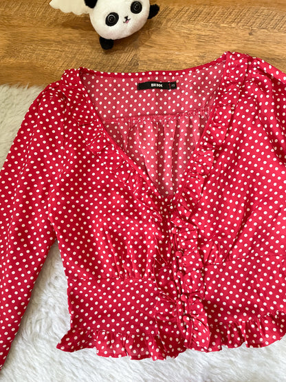 red polka dot top