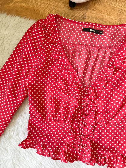 red polka dot top
